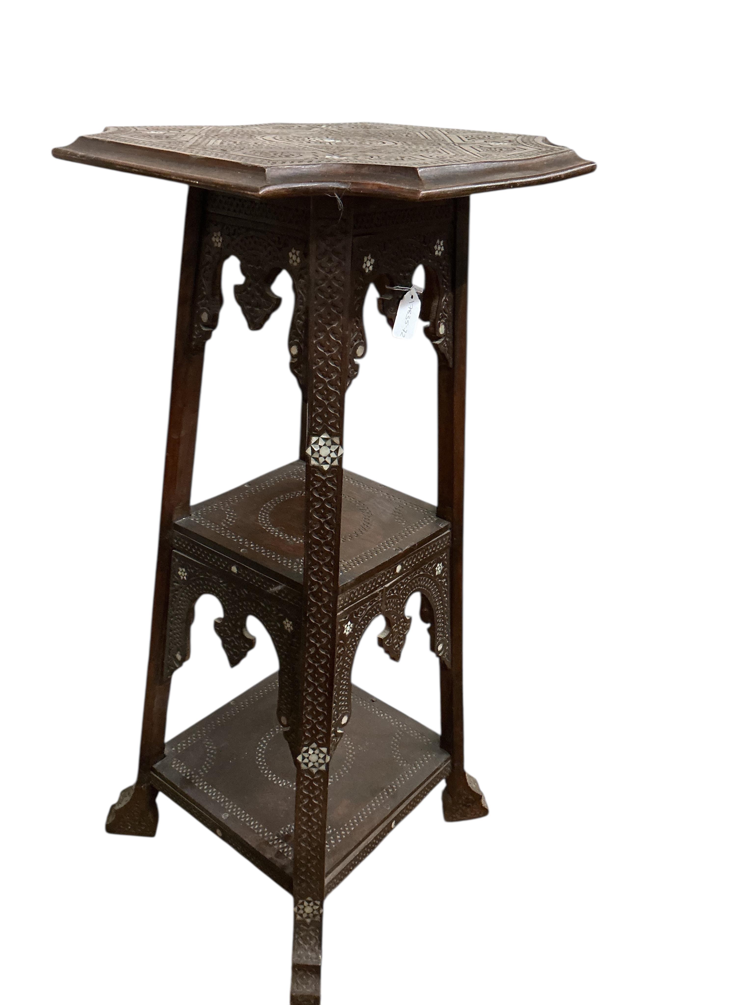 A Damascan mother of pearl inlaid carved hardwood three tier plant stand, width 48cm, height 102cm